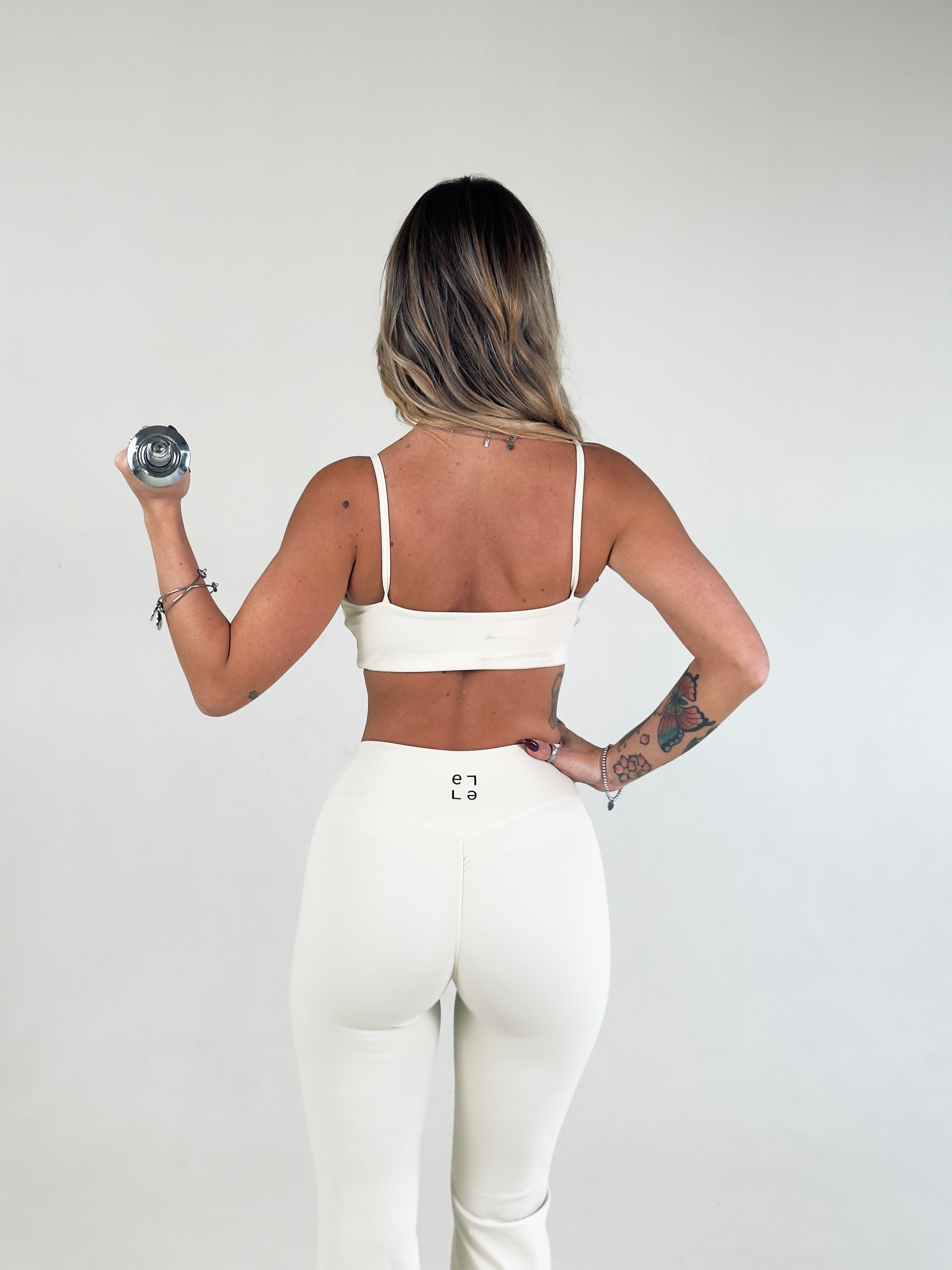 Top a spalla Eleganza Sportiva  Crema